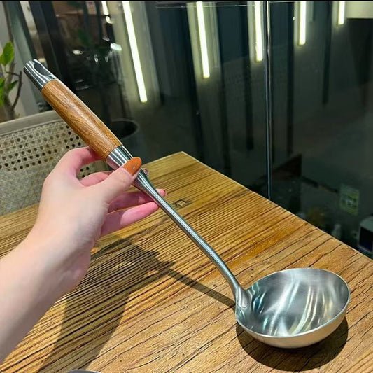 Stainless steel soup spoon with pearwood handle